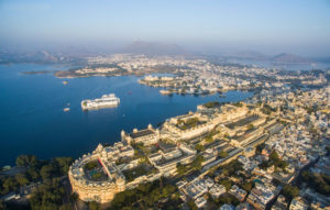 It shows the aerial view of Udaipur City